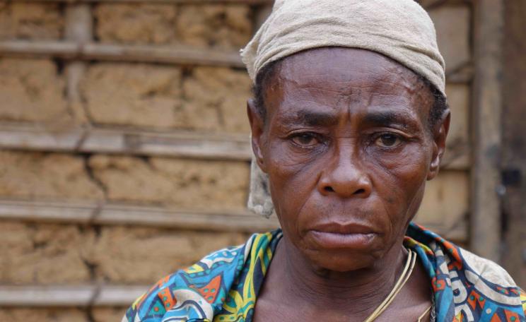 A Baka woman whose husband, named Komanda, was arrested by rangers in Messok Dja, then imprisoned on false accusations of poaching. In prison he was brutally assaulted by other prisoners, and died soon after being released.