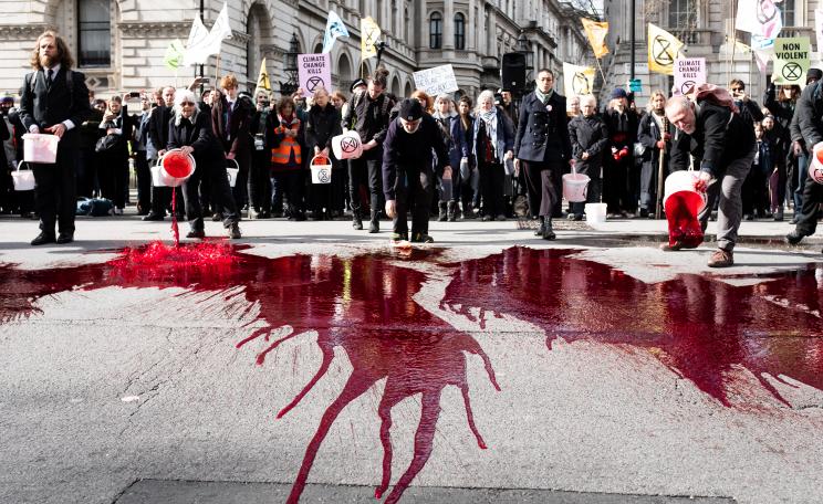 Protesters spill fake blood outside Downing Street