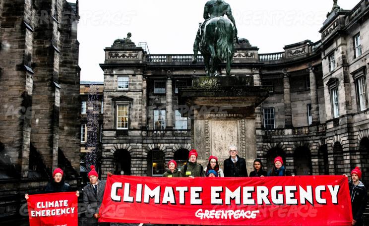 Greenpeace supporters outside Edinburgh's Court of Session