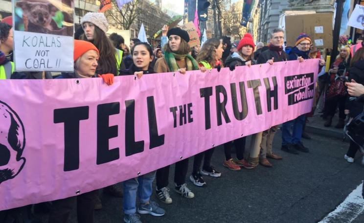 Members of XR hold up a "Tell the Truth" banner in London while protesting against the Australian government's response to the bushfires.