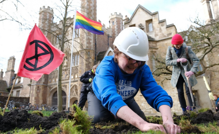 XR activist digging up lawn